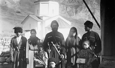 People in front of the church at Dallagkau near Kazbek. Photograph by Baddeley. Dallagkau, Republic of North Ossetia-Alania, Russia. August 1902.