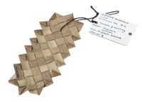 A small piece of mat woven from diagonally crossed plant fibres